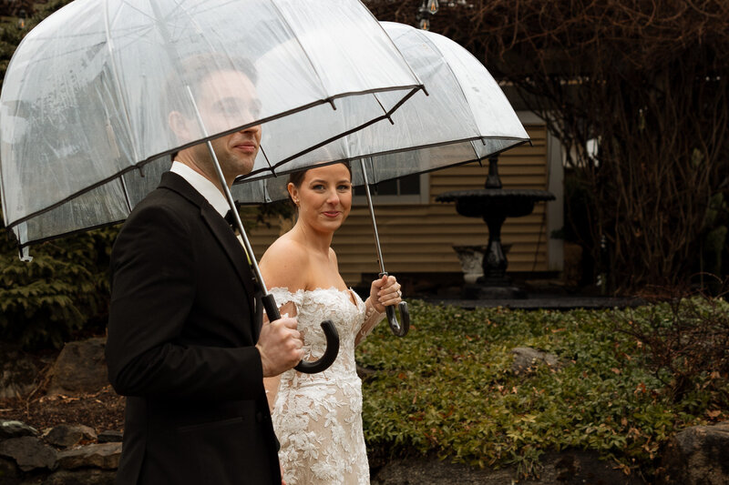 Couple by the fountain for some portraits | Bedford Village Inn