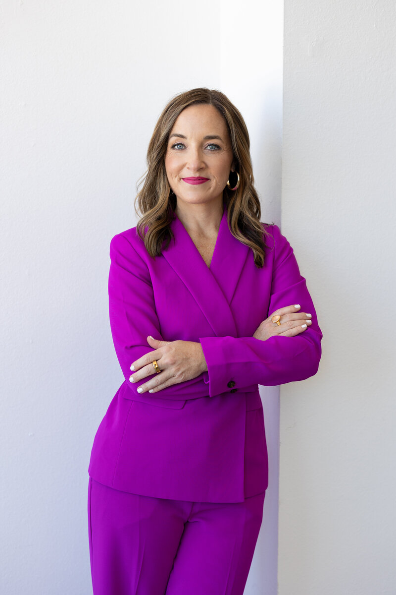 Kristen Sharp  headshot with purple suit