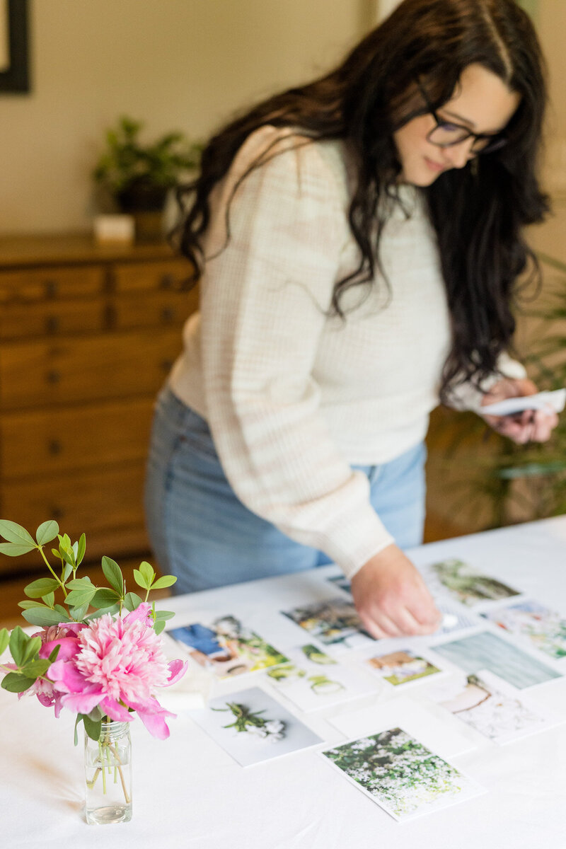 Aubre creating a mood board by collaging photos and color swatches