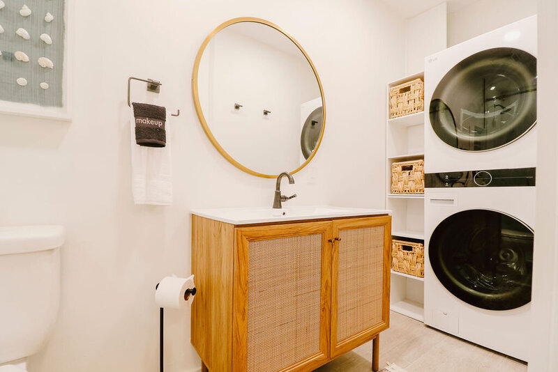 bathroom with stackable washer dryer