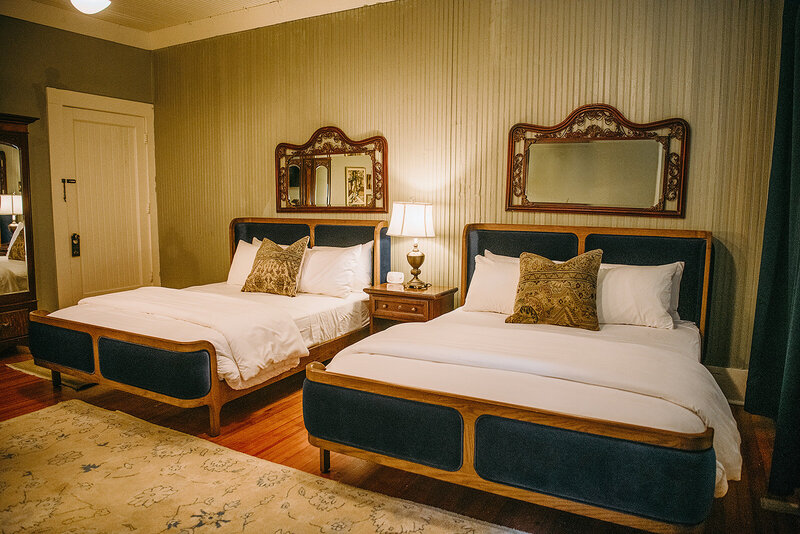 A spacious room with 2 queen beds