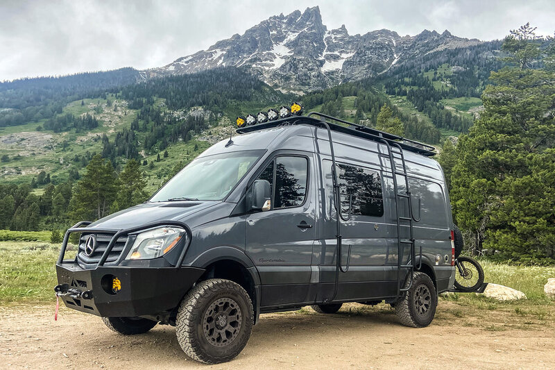 Trail ready with extended fuel tank and 2 spare tires on this camper van rental