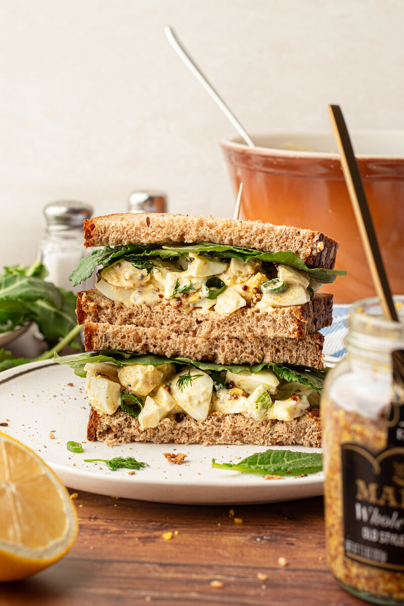 halves of an egg salad topped vertically