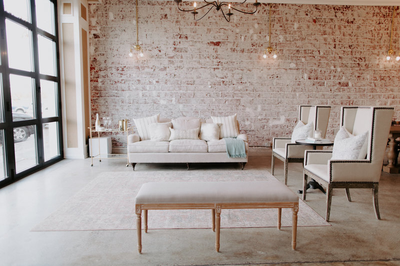 Couch, chairs, and bench included in our lounge area of the studio.