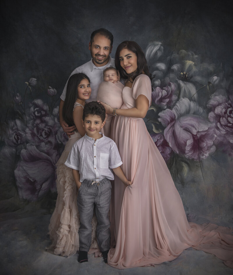  "A heartwarming family portrait featuring a newborn baby and their big brother, captured in a tender moment at Sonia Gourlie Fine Art Photography in Ottawa."