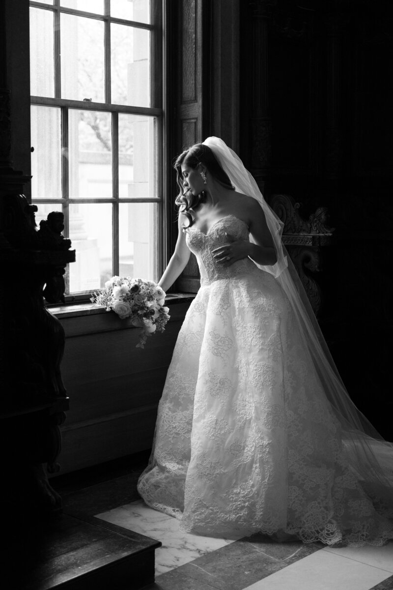 Bridal Portrait. Bride standing in window of the War memorial in Grosse Pointe, MI. 
