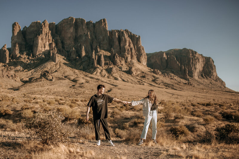 couple dancing for engagement session at superstition mountain