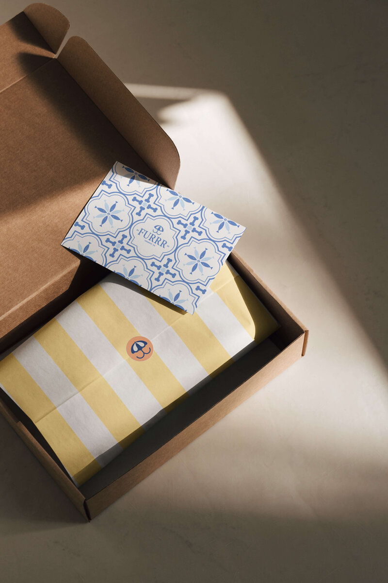 Heritage-style geometric wrapping paper featuring Winston & Co luxury dog treat logo and traditional design elements.