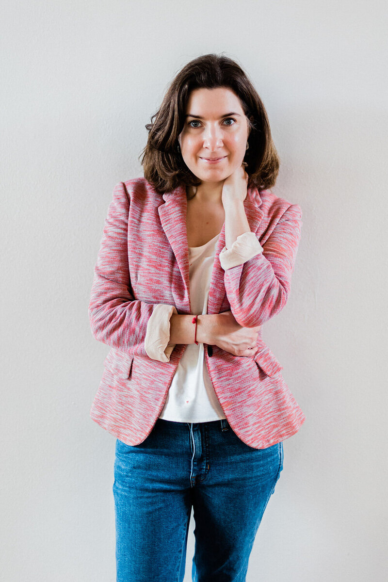 Photo of Andrea Shah standing against a plain white background