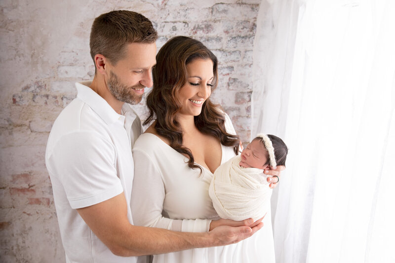 Relax and let us handle the details during your in-studio newborn session, from props to poses, for perfect results.