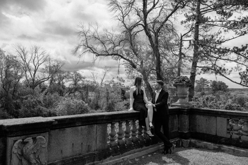 Editorial-style engagement portraits in a scenic outdoor location.