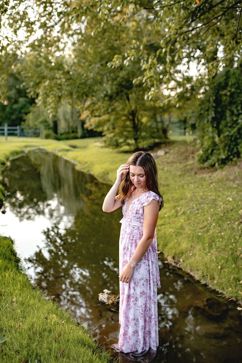senior-girl-standing-in-creek