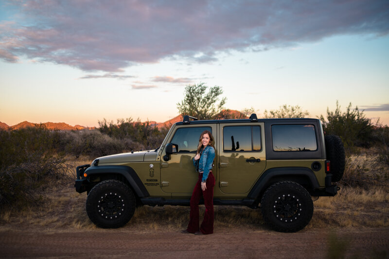 Wedding photographer standing in front of jeep wrangler