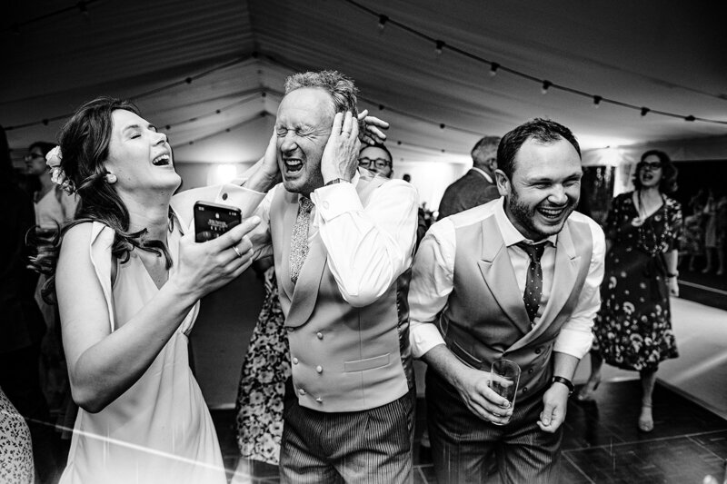 bride dancing having fun on the dance floor with her friends at the basin harbour in Vermont 