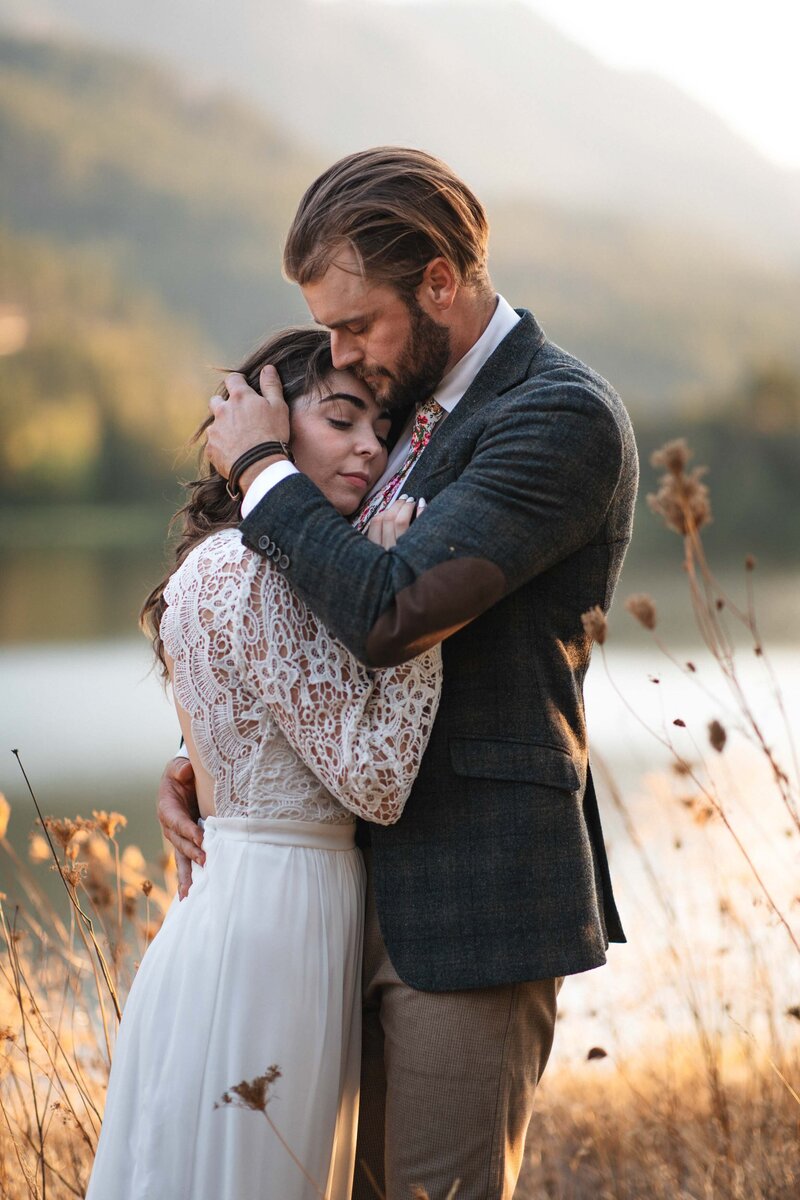 A wedding couple embrace each other in the Columbia River Gorge at Government Cove Overlook.