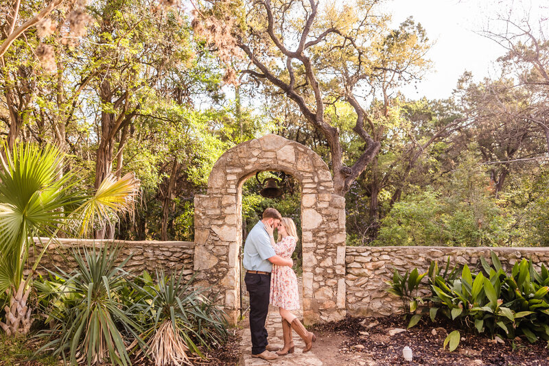 Couple enjoy exploring during their engagement session at Mayfield Park in Austin, Texas. Photo taken by Austin Engagement Photographers, Joanna & Brett Photography