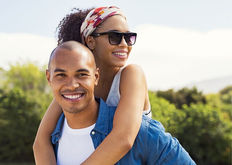 young black couple smiling