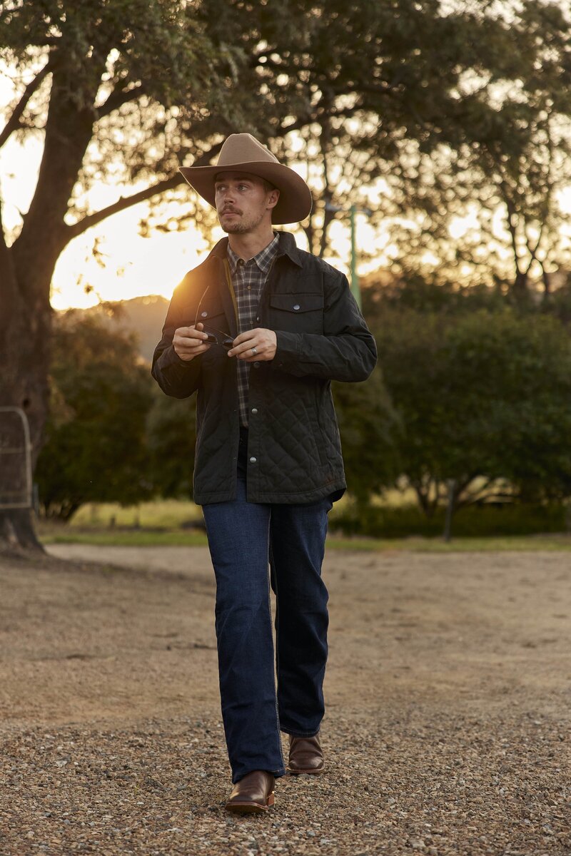 Male model in farm outfit at sunset