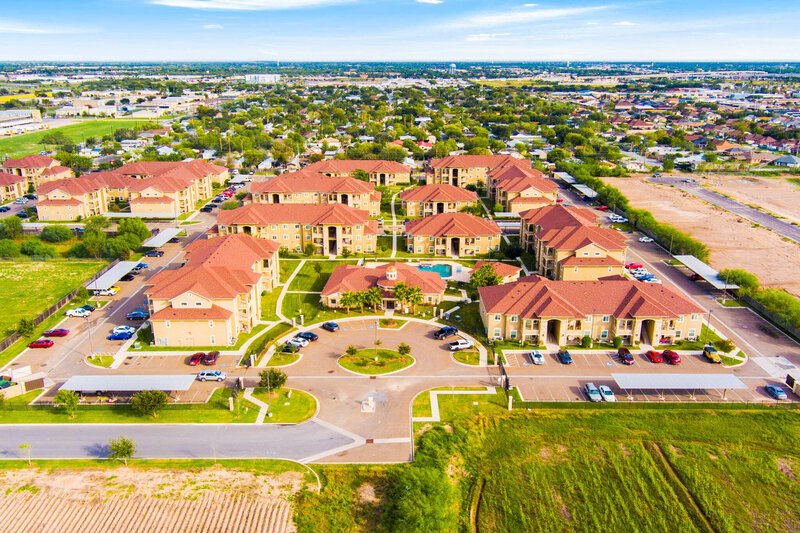 Aerial drone view of Jackson Place Apartments in Pharr Texas showing the full community layout and property grounds overseen by WLS Interests.