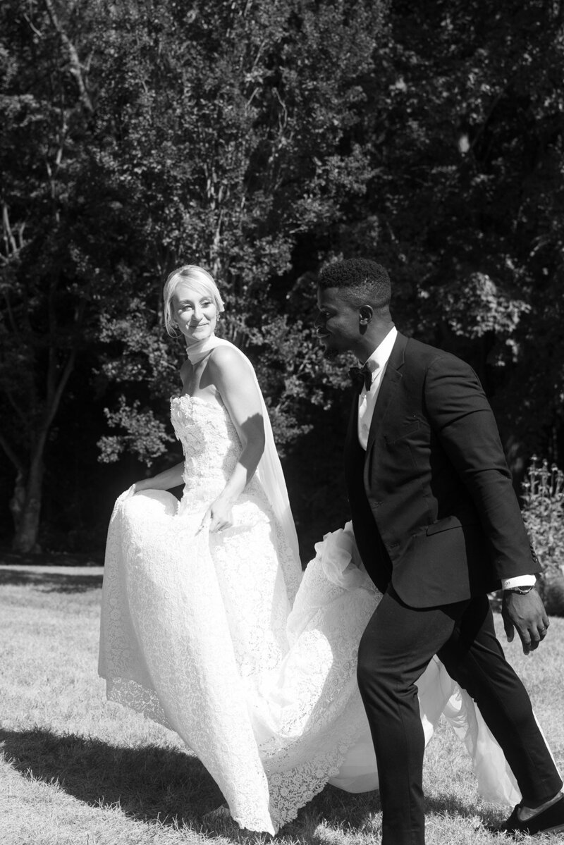 Artistic photo of a couple on their wedding day with a bouquet