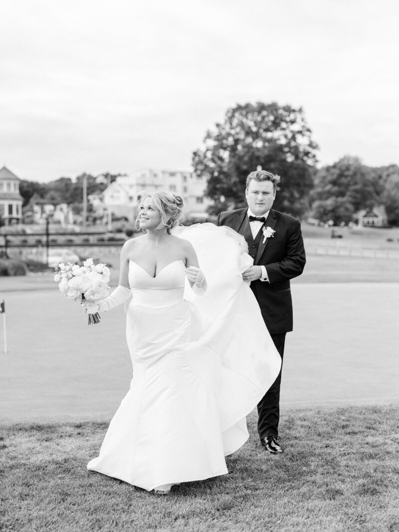 couple walking on golf course 