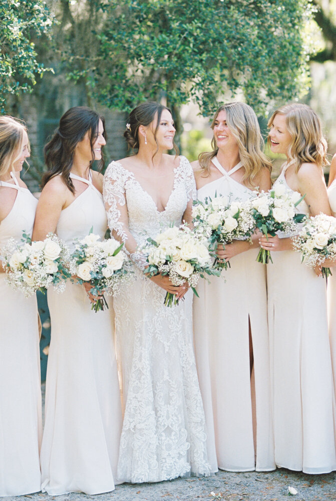 bridesmaids and bride holding bouquets