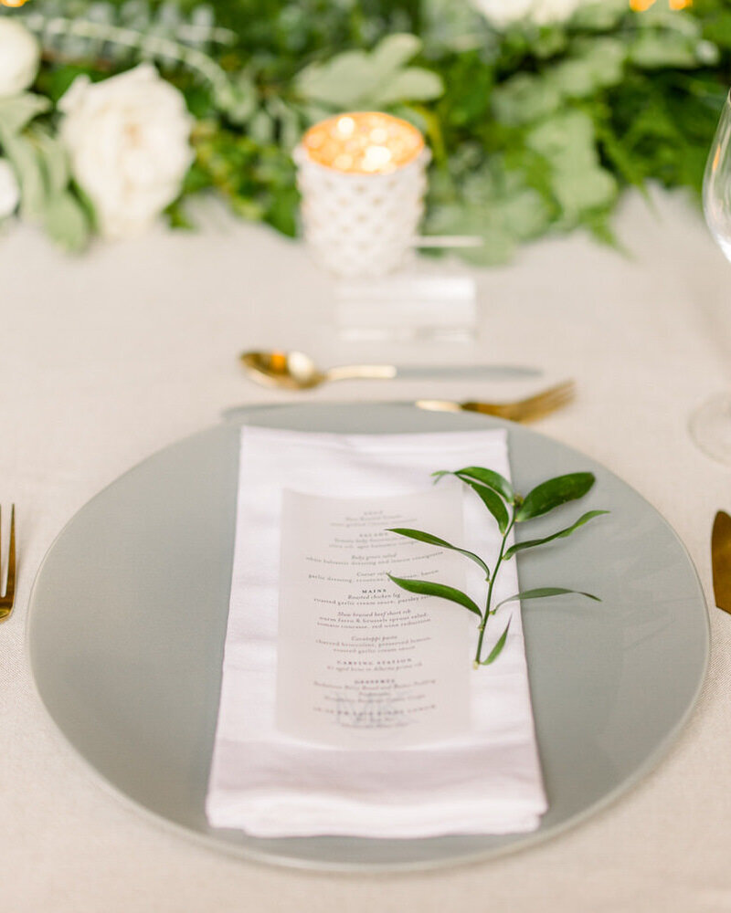 This beautifully detailed close-up photograph captures the elegant dinner reception setting at the Fairmont Banff Springs Hotel. The luxurious table arrangements and sophisticated decor reflect the timeless charm and grandeur of the historic venue.