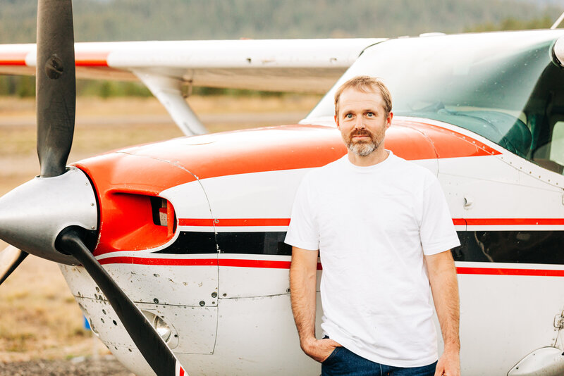 Walt Smith standing beside his airplane