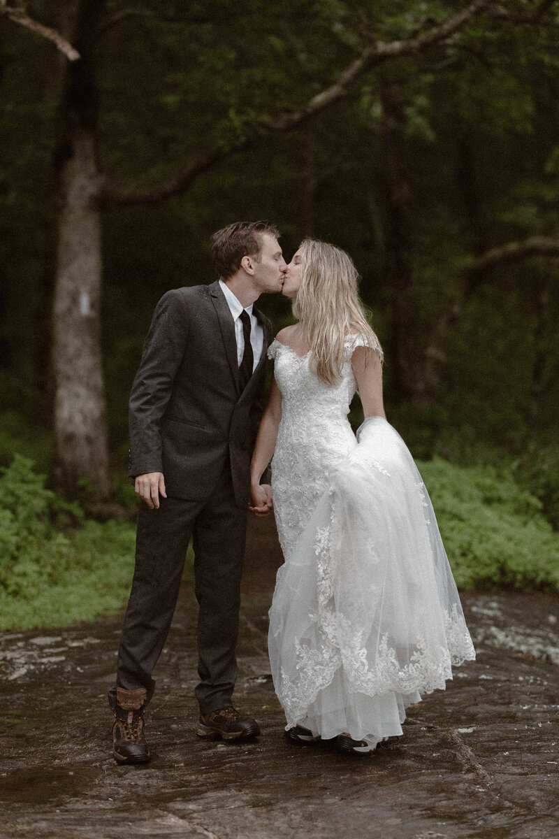 Couple kissing in wedding attire on the Appalachian Trail