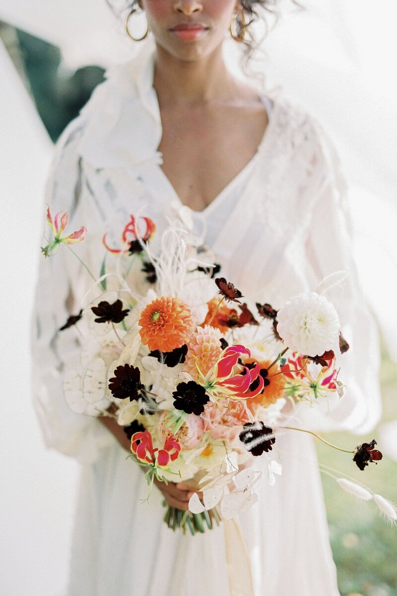 woman-white-dress-with-bouquet-flowers-closeup