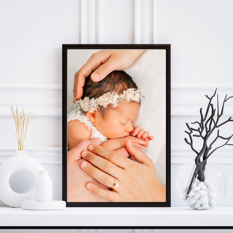 newborn photo framed of family cuddling in playroom captured by Springfield MO family photographer Jessica Kennedy of The XO Photography