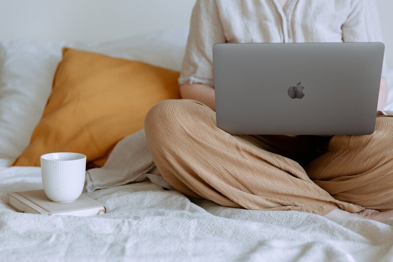 Woman leader reviewing thought leadership content on her laptop