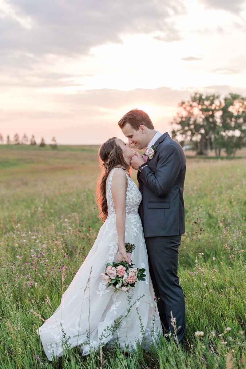 Karli and Daniel smile together at August House wedding venue in Dickinson, North Dakota, sharing their praise for the venue’s attention to detail and seamless day-of coordination.