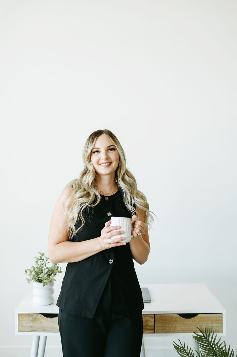 Karly Whitaker setting up custom HoneyBook workflows and automations for a service-based business owners.