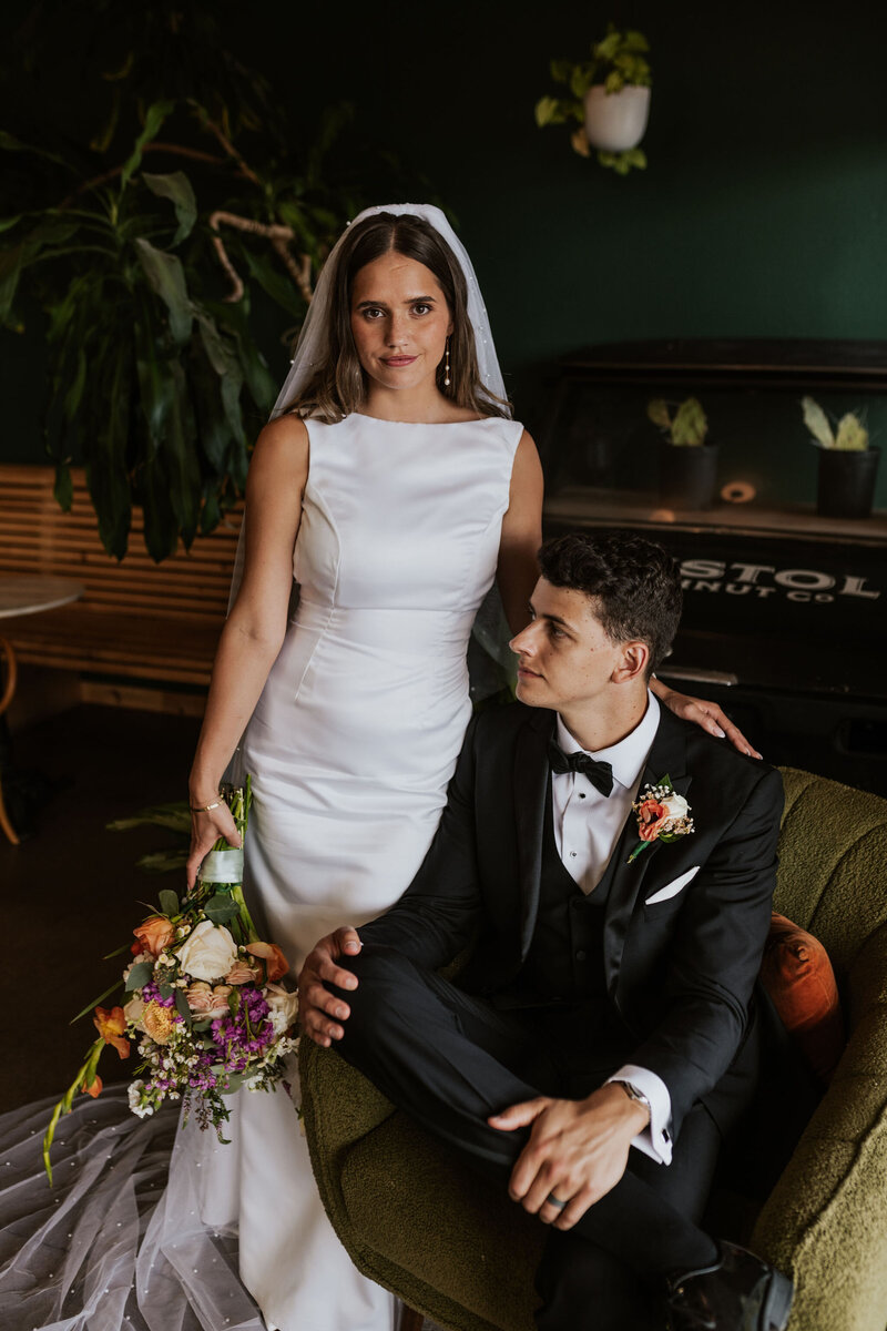 bride and groom posing together in stylish wedding attire