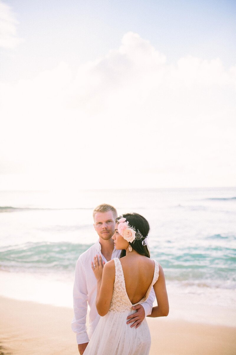 RomanticCouplesPoseSunsetBeachOahu
