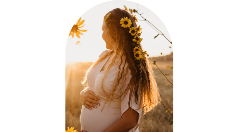 Pregnant woman with flowers in her hair