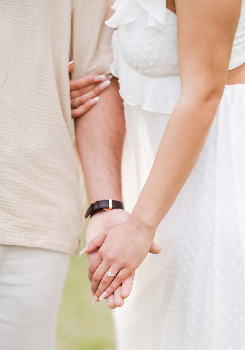 A couple holding hands.