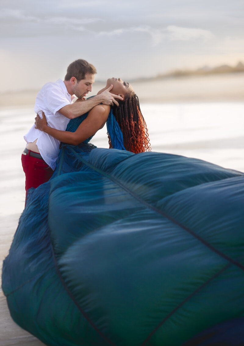 Savannah Georgia Boudoir and Glamour couple with woman in blue parachute gown on beach2