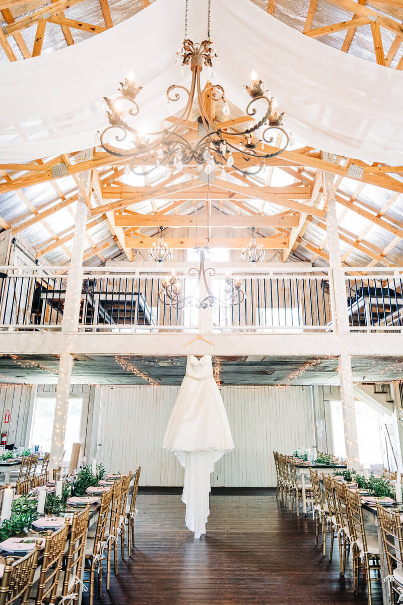 A dress hangs from a luxury barn located on the border of Indiana and Ohio.