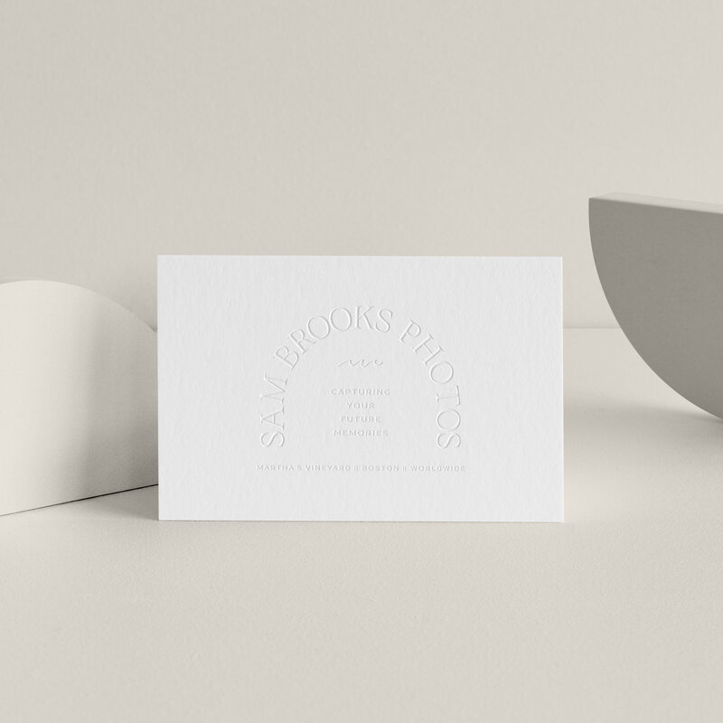 a mockup showing an arch logo on white stationery