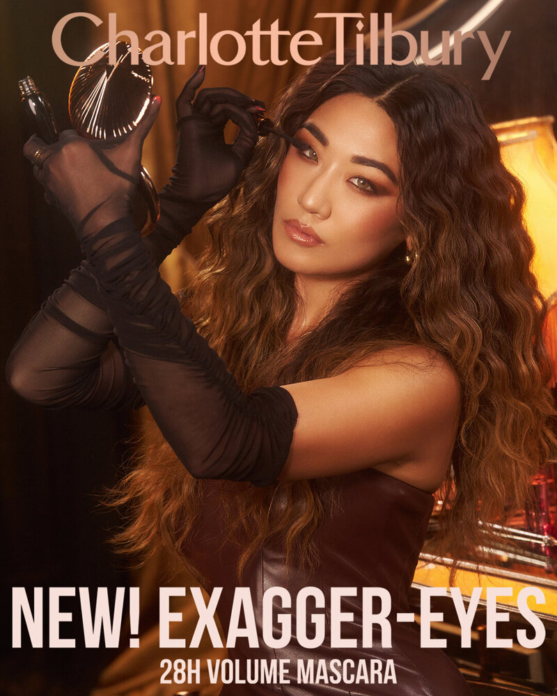 Soo Youn Lee posing with a confident expression for the Charlotte Tilbury 'Exagger-Eyes' 28H Volume Mascara campaign, photographed by Ylva Erevall.