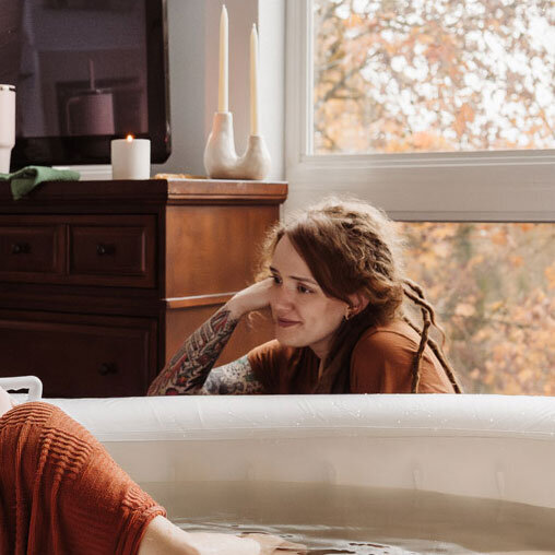 Natalie Broders birth doula with a client in the birth tub at a home birth