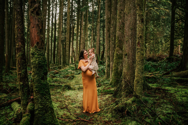 mom with toddler in the woods