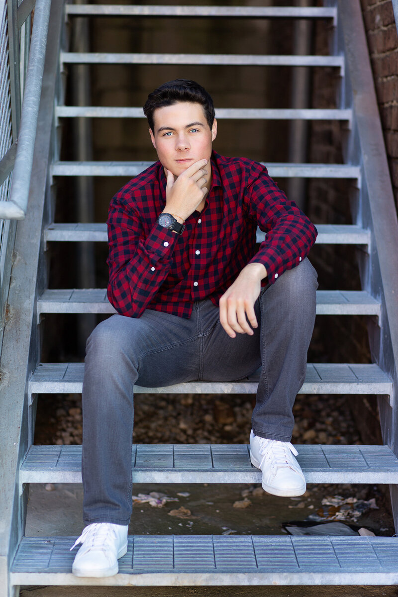 Peyton casually sitting on the stairs for his Birmingham, AL senior session.