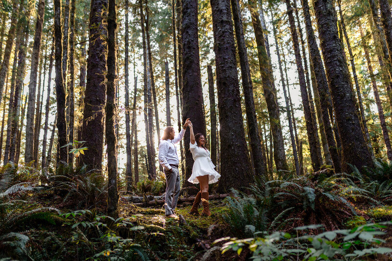 Couple exchanging vows surrounded by towering trees in an intimate forest setting, captured by an Oregon Coast Elopement and Wedding Photographer.