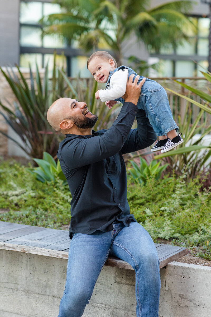 Father laughing with son at Pacific City in Huntington Beach