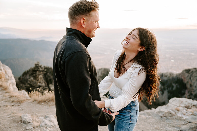 man holding up woman