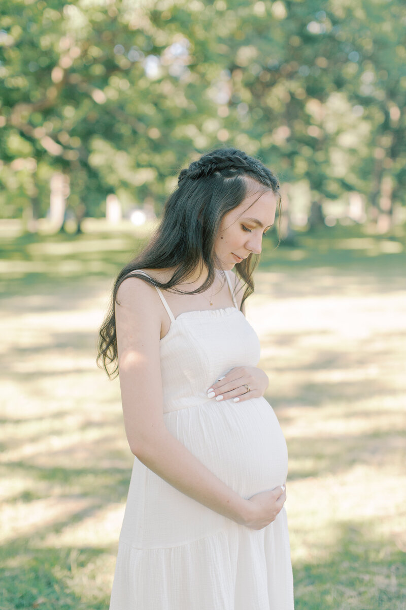 pregnant mother holding their bump