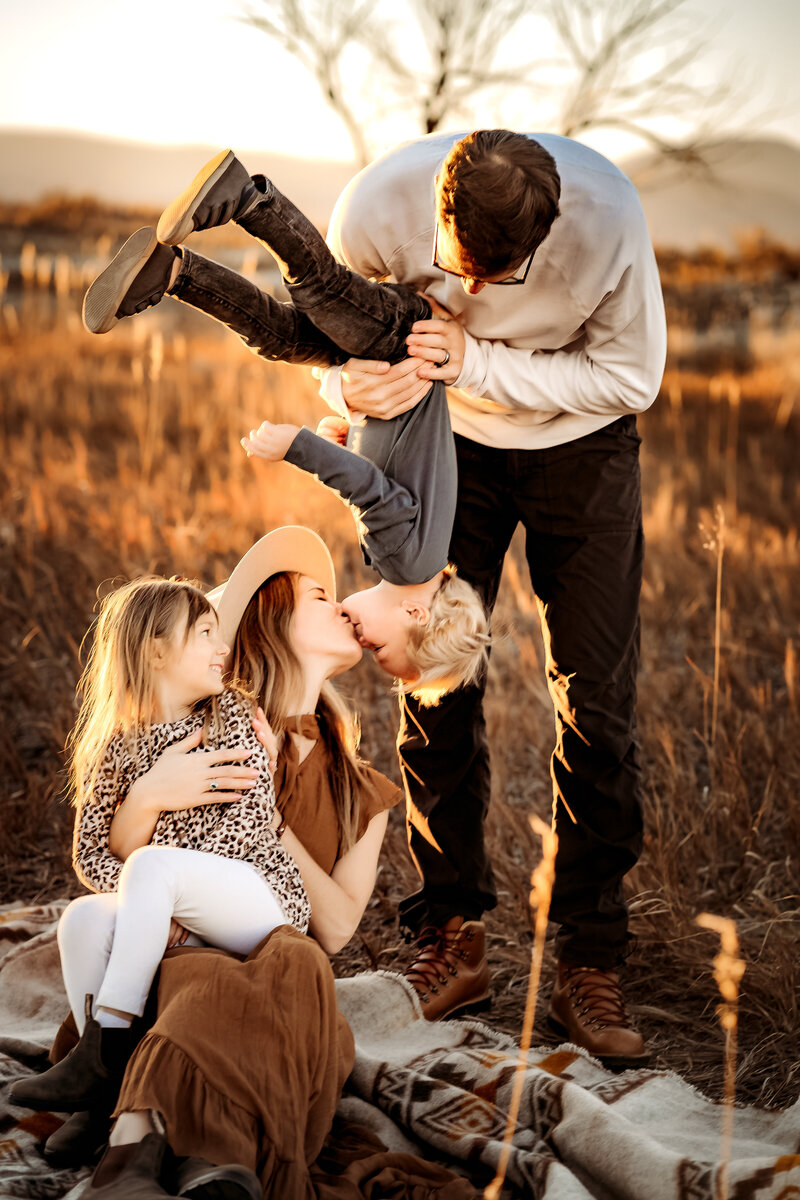 fun family snuggle sunset